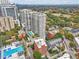 Aerial view of apartment buildings, trees and an in-ground pool on top of a building at 206 Ne 11Th Ne St # 703A, Atlanta, GA 30309