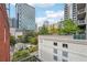 Balcony view of the surrounding buildings and city skyline on a sunny day at 206 Ne 11Th Ne St # 703A, Atlanta, GA 30309
