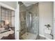 Modern bathroom with glass shower, decorative tile, and access to the Primary bedroom at 206 Ne 11Th Ne St # 703A, Atlanta, GA 30309