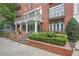 Classic brick building exterior with well-maintained landscaping and wrought iron balconies, exuding sophistication at 206 Ne 11Th Ne St # 703A, Atlanta, GA 30309