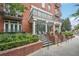 Elegant brick building exterior with manicured landscaping and wrought iron balconies, offering timeless appeal at 206 Ne 11Th Ne St # 703A, Atlanta, GA 30309