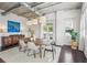 Dining room features wood table, bright windows, and dark wood flooring at 206 Ne 11Th Ne St # 703A, Atlanta, GA 30309