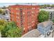 Brick apartment building featuring white framed windows and small, dark metal balconies at 206 Ne 11Th Ne St # 703A, Atlanta, GA 30309
