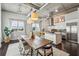 Open kitchen and dining area with stainless steel appliances, exposed ducts, and modern decor at 206 Ne 11Th Ne St # 703A, Atlanta, GA 30309