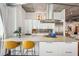 Modern kitchen boasts stainless appliances, white cabinets, an island, and bar stool seating at 206 Ne 11Th Ne St # 703A, Atlanta, GA 30309