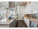 A stylish kitchen features stainless steel appliances, a large island, and concrete ceiling details at 206 Ne 11Th Ne St # 703A, Atlanta, GA 30309