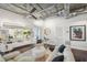 Living room with white couches, dark floors, exposed ducts, and recessed lighting at 206 Ne 11Th Ne St # 703A, Atlanta, GA 30309