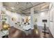 Bright living room with dark wood floors, exposed ducts, concrete pillars and modern decor at 206 Ne 11Th Ne St # 703A, Atlanta, GA 30309