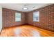 Charming bedroom with exposed brick wall, hardwood floors and bright windows at 36 Daniel Se St # 5, Atlanta, GA 30312