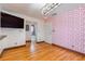 Bright living room with hardwood floors, bold patterned wallpaper, and an abundance of natural light at 36 Daniel Se St # 5, Atlanta, GA 30312