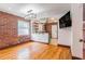 Inviting living room with exposed brick wall and updated lighting fixture at 36 Daniel Se St # 5, Atlanta, GA 30312