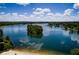 Gorgeous aerial view of an island with a dock nestled in a serene lake community at 8088 Lakeview Pkwy, Villa Rica, GA 30180