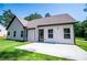 A patio area and green lawn in the backyard at 8088 Lakeview Pkwy, Villa Rica, GA 30180