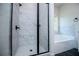 Beautiful bathroom featuring a glass shower door with marble tiles and a separate soaking tub at 8088 Lakeview Pkwy, Villa Rica, GA 30180