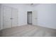 Inviting bedroom featuring neutral carpet, double doors, and an open doorway for seamless flow at 8088 Lakeview Pkwy, Villa Rica, GA 30180