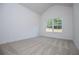 Well-lit bedroom features plush carpeting, large windows and neutral walls, creating a serene atmosphere at 8088 Lakeview Pkwy, Villa Rica, GA 30180