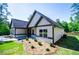 Beautiful one-story home with gray siding, stone accents, and a well-maintained lawn at 8088 Lakeview Pkwy, Villa Rica, GA 30180