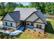 Beautiful one-story home featuring gray siding, stone accents, and a lush green lawn at 8088 Lakeview Pkwy, Villa Rica, GA 30180
