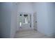 Bright foyer with tall ceilings, modern light fixture, and a beautiful front door at 8088 Lakeview Pkwy, Villa Rica, GA 30180