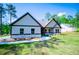 Charming one-story home with gray siding, stone accents, and a well-manicured lawn at 8088 Lakeview Pkwy, Villa Rica, GA 30180