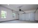 A clean, spacious two-car garage featuring an automatic door opener and natural light at 8088 Lakeview Pkwy, Villa Rica, GA 30180