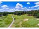 Picturesque view of the golf course with manicured greens, blue skies, and scattered trees for a relaxing atmosphere at 8088 Lakeview Pkwy, Villa Rica, GA 30180