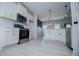 Bright kitchen features stainless steel appliances, white cabinets, and modern lighting at 8088 Lakeview Pkwy, Villa Rica, GA 30180