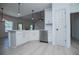 Bright kitchen with stainless steel dishwasher and white cabinets at 8088 Lakeview Pkwy, Villa Rica, GA 30180