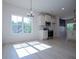 Sunlit dining area with modern chandelier and stainless steel appliances at 8088 Lakeview Pkwy, Villa Rica, GA 30180
