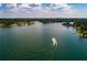 Scenic view of lake with beautiful waterfront homes and a boat cruising by at 8088 Lakeview Pkwy, Villa Rica, GA 30180