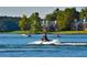 Active lake with boaters enjoying the water near waterfront property at 8088 Lakeview Pkwy, Villa Rica, GA 30180