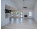 Bright living room with light flooring, fireplace, and seamless access to the kitchen at 8088 Lakeview Pkwy, Villa Rica, GA 30180