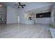 Spacious living room with light flooring, high ceilings, and an open layout to the kitchen at 8088 Lakeview Pkwy, Villa Rica, GA 30180