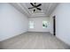 Spacious main bedroom with tray ceiling and plush carpeting at 8088 Lakeview Pkwy, Villa Rica, GA 30180