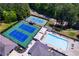 Overhead view of the community tennis and basketball courts near a pool for diverse recreation at 8088 Lakeview Pkwy, Villa Rica, GA 30180