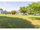 Expansive backyard featuring a well-manicured lawn and mature trees, providing ample outdoor space at 1490 Twin Manor Dr, Loganville, GA 30052
