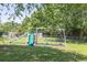A backyard playset with a slide, swing and climbing equipment offering outdoor entertainment for children at 1490 Twin Manor Dr, Loganville, GA 30052