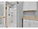 Bathroom with a shower and white vanity with a light countertop and ample storage space at 1490 Twin Manor Dr, Loganville, GA 30052