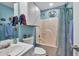 Bathroom with a tub-shower, sink, and nautical-themed decor at 1490 Twin Manor Dr, Loganville, GA 30052