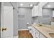 Bright bathroom featuring a double sink vanity, toilet, and shower with a sliding door at 1490 Twin Manor Dr, Loganville, GA 30052