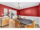 Cozy dining area with a chandelier and an adjacent kitchen equipped with stainless steel appliances at 1490 Twin Manor Dr, Loganville, GA 30052