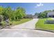 Street view of a home with a long driveway leading to a two-car garage at 1490 Twin Manor Dr, Loganville, GA 30052