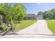 Well-maintained single-story home with a driveway leading to an attached garage and a mailbox at 1490 Twin Manor Dr, Loganville, GA 30052