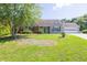 Charming single-story home with a well-manicured lawn and an attached two-car garage at 1490 Twin Manor Dr, Loganville, GA 30052