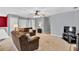 Spacious living room with neutral walls, carpet flooring, and ample seating at 1490 Twin Manor Dr, Loganville, GA 30052
