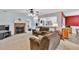 Bright living room with a fireplace and an open view to the kitchen and dining area at 1490 Twin Manor Dr, Loganville, GA 30052
