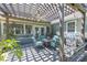 Outdoor patio with pergola, grill, and comfortable seating, ideal for relaxation and entertaining at 1490 Twin Manor Dr, Loganville, GA 30052