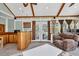 Cozy sunroom with vaulted ceilings, comfortable seating area, built in wet bar, and multiple windows at 1490 Twin Manor Dr, Loganville, GA 30052