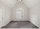 Carpeted bedroom featuring a vaulted ceiling and a large window with natural light at 2058 Drogheda Ln, Marietta, GA 30066