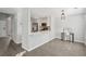 Open concept kitchen featuring stainless steel appliances, modern lighting, and a breakfast bar at 2058 Drogheda Ln, Marietta, GA 30066